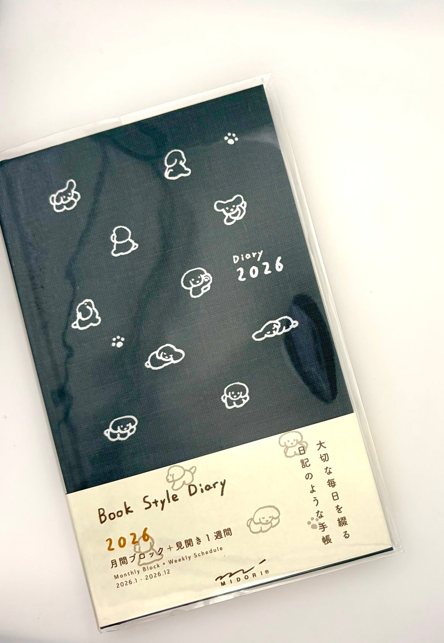 Diary with white dog design on a dark blue background